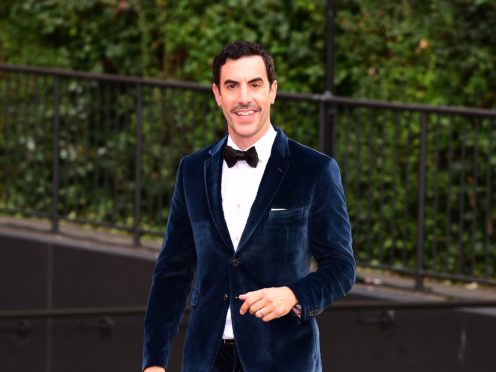 Sacha Baron Cohen revealed his double life as a Covid-19 vaccine dealer to the rich and famous as he starred in a TV sketch (Ian West/PA)