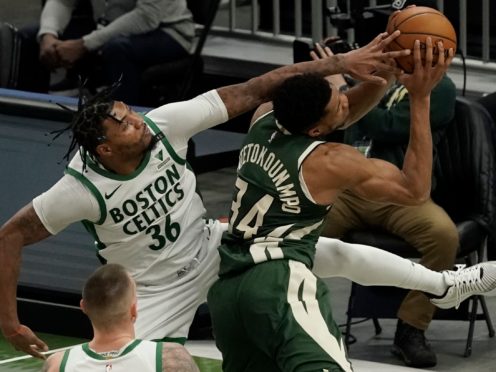 Boston Celtics’ Marcus Smart fouls Milwaukee Bucks’ Giannis Antetokounmpo (Morry Gash/AP)