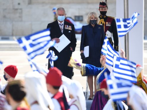The Prince of Wales and Duchess of Cornwall attend the Independence Day Military Parade in Syntagma Square, Athens (Victoria Jones/PA)