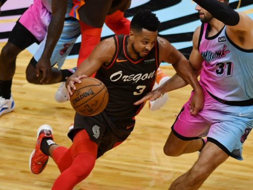 Portland Trail Blazers guard CJ McCollum drives as Miami Heat guard Max Strus defends (Jim Rassol/AP)