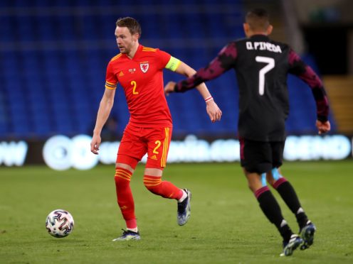 Chris Gunter (left) won his 100th cap for Wales against Mexico (David Davies/PA).