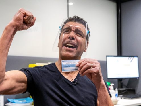 Football pundit Chris Kamara receives his Covid-19 vaccination (Peter Byrne/PA)Editors note some information on vaccination card pixellated by PA Picture DeskFootball pundit Chris Kamara, receives his Covid-19 vaccination at the Village Hotel in Morley, Leeds. TV presenter Chris Kamara has urged people from black, Asian and minority ethnic (BAME) communities to get the Covid-19 vaccine. Picture date: Wednesday March 3, 2021. PA Photo. See PA story HEALTH Coronavirus. Photo credit should read: Peter Byrne/PA Wire