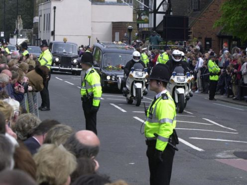 Police line the route of the Queen Mother’s funeral cortege in Windsor (Tim Ockenden/PA)