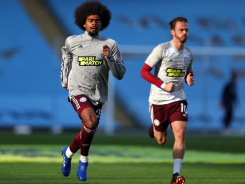 Leicester City’s Hamza Choudhury (left) and James Maddison warming up before the Premier League match at the Etihad Stadium, Manchester.