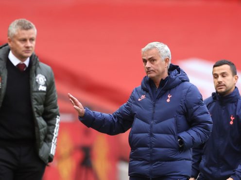 Jose Mourinho, centre, does not agree with Ole Gunnar Solskjaer’s opinion on winning trophies (Carl Recine/PA)