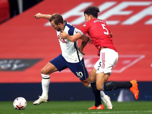 Harry Maguire and Harry Kane will go head to head on Sunday (Carl Recine/PA)