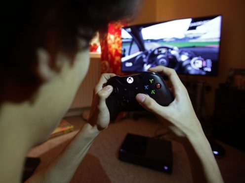 Playing video games has become a vital resource for young people to socialise with friends during the latest lockdown, according to new research (Yui Mok/PA)