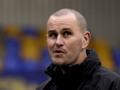 Mark Robinson is not getting carried away with AFC Wimbledon’s huge win (Steven Paston/PA)