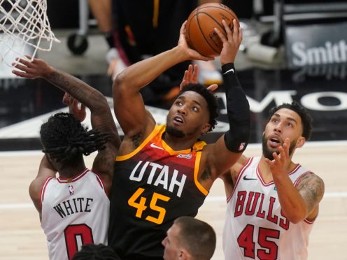 Utah Jazz guard Donovan Mitchell (45) goes to the basket as Chicago Bulls’ Coby White (0) and Denzel Valentine (45) defend (Rick Bowmer/AP)