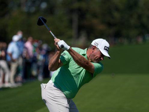 Lee Westwood hits his tee shot on the first hole during a practice round for the Masters (David J Phillip/AP)