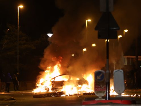 A car burns on Sperrin Road, Waterside, Londonderry (Liam McBurney/PA)