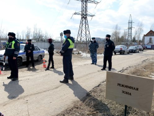 Police officers stand at the ntrance of the prison colony IK-2 (Denis Kaminev/AP)