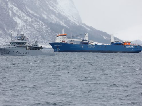The Dutch cargo ship Eemslift Hendrika is guided to land at Alesund, Norway (Svein Ove Ekornesvag / NTB)