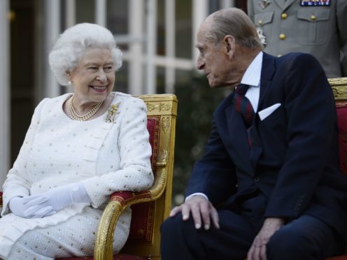 The Queen and the Duke of Edinburgh attending a garden party in Paris (Owen Humphreys/PA)