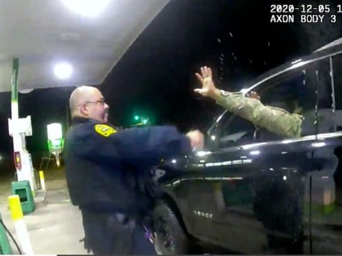 One of two police officers accused of pepper-spraying and pointing their guns at a black US army officer during a traffic stop has since been fired, authorities in Virginia have said (Windsor Police/AP)
