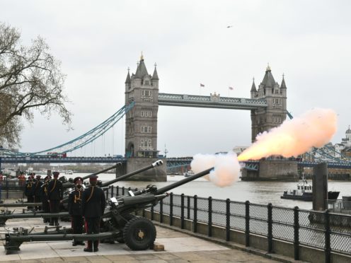 Members of the Honourable Artillery Company fire a 41-round gun salute from the wharf at the Tower of London (Dominic Lipinski/PA)