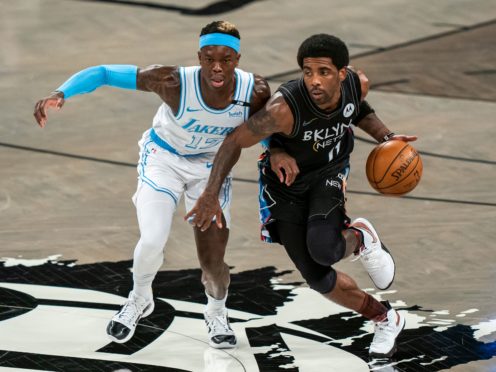 Los Angeles Lakers guard Dennis Schroder (17) defends against Brooklyn Nets guard Kyrie Irving (11) (Corey Sipkin/AP)