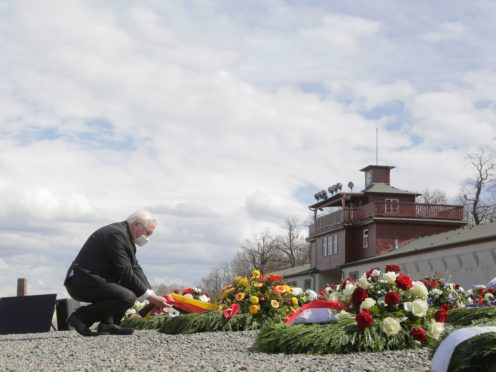 German President Frank-Walter Steinmeier lays a wreath during events marking the 76th anniversary of the liberation of the Buchenwald Nazi concentration camp near Weimar (Markus Schreiber/AP)
