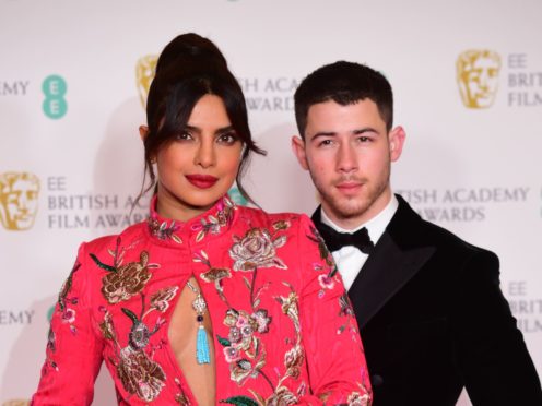Priyanka Chopra Jonas and her husband Nick Jonas at the Baftas 2021 (Ian West/PA)