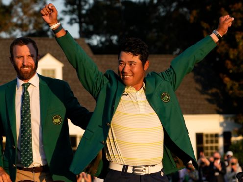 Hideki Matsuyama, right, receives the green jacket from 2020 winner Dustin Johnson (David J. Phillip/AP)