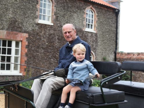 Duke of Edinburgh with Prince George in Norfolk in 2015 (Duchess of Cambridge/PA)