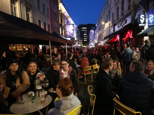 People gather for drinks and food in Old Compton Street, Soho (PA)