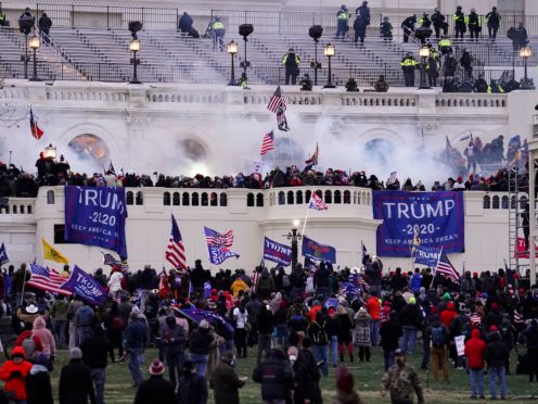 People storm the Capitol in Washington on January 6 (John Minchillo/AP)