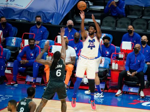 Philadelphia 76ers’ Joel Embiid, right, goes up for a shot against Brooklyn Nets’ DeAndre Jordan in their NBA clash (Matt Slocum/AP)