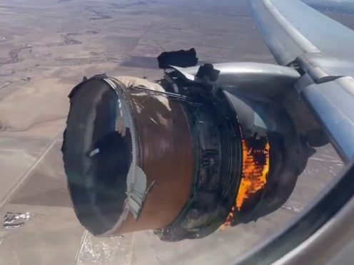 The engine of United Airlines Flight 328 on fire (Chad Schnell via AP)