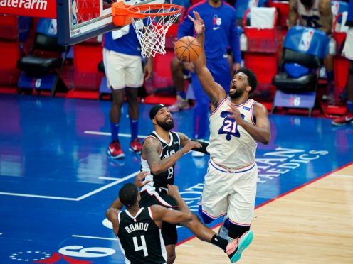 Joel Embiid, right, poured in 36 points and had 14 rebounds (Matt Slocum/AP)