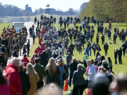 People gather on the Long Walk as the King’s Troop Royal Horse Artillery make their way towards Windsor Castle (Andrew Matthews/PA)