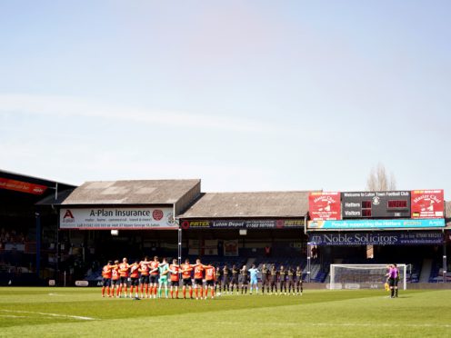 Luton Town and Watford players stand for a minute’s silence in memory of the Duke of Edinburgh (Tess Derry/PA)