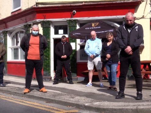 Drinkers at the Duke of Edinburgh pub in Hull observe a minute’s silence (Richard McCarthy/PA)