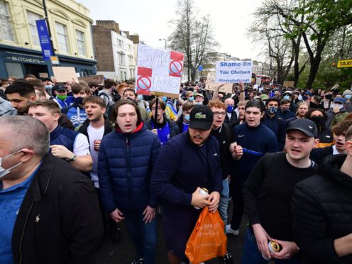 Chelsea fans protest against the Super League ahead of their match against Brighton on Tuesday (PA)
