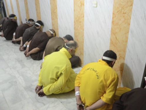 Blindfolded prisoners await their executions in Iraq (File/Iraq Ministry of Justice/AP)