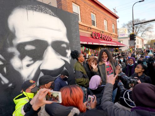 Angela Harrelson, center, aunt of George Floyd, talks to supporters at George Floyd Square after a guilty verdict was announced at the trial of former Minneapolis police Officer Derek Chauvin for the 2020 death of Floyd, Tuesday, April 20, 2021, in Minneapolis. Former Minneapolis police Officer Derek Chauvin has been convicted of murder and manslaughter in the death of Floyd. (AP Photo/Julio Cortez)