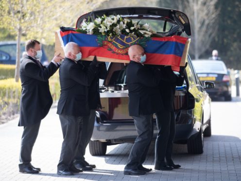 Pallbearers carry the coffin of D-Day veteran Albert Lilly into the chapel at the Oaks Havant Crematorium in Hampshire, for his funeral service. Picture date: Wednesday April 21, 2021.