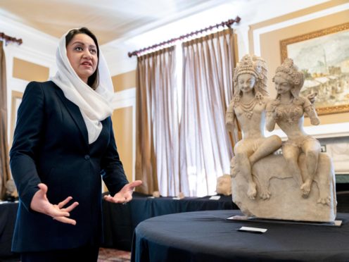 Afghan ambassador to the US Roya Rahmani at the Afghanistan embassy in Washington with looted and stolen Afghan religious relics and antiquities recovered by US government authorities (Andrew Harnik/AP)