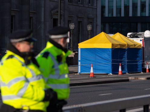 Police tents outside Fishmongers’ Hall, on London Bridge, following the terrorist attack (PA)