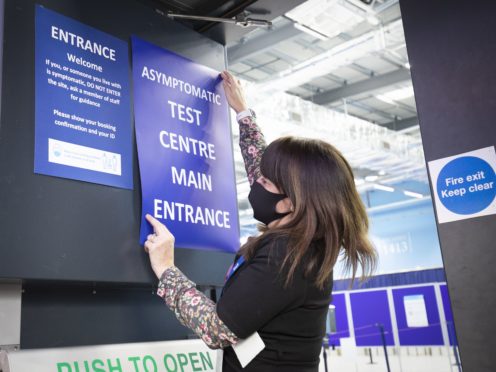Students get a Covid-19 test at a mass testing centre set up at the sports centre at St Andrews University, ahead of the Christmas holiday.