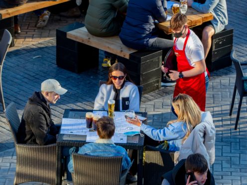 Social distancing rules are reportedly going to be scrapped for hospitality from June 21 (Peter Byrne/PA)