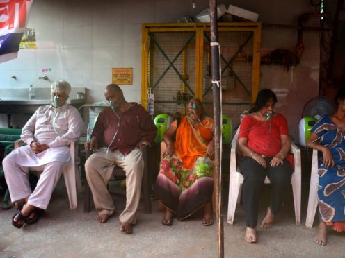 Covid-19 patients receive oxygen outside a Sikh house of worship in New Delhi on Saturday (Amit Sharma/AP)