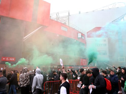 Manchester United fans protest against the club’s owners outside Old Trafford on Sunday (PA)