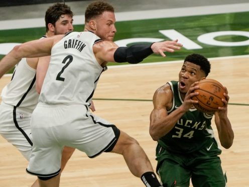Milwaukee Bucks’ Giannis Antetokounmpo, right, helped them to victory (Morry Gash/AP)