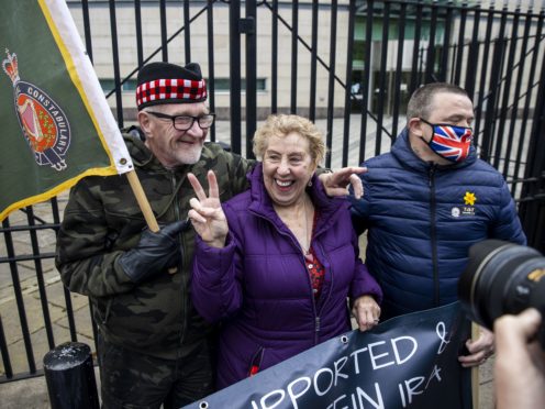 Supporters of the two veterans accused of the murder of Joe McCann in 1972 celebrate after hearing the case at Laganside Court in Belfast has collapsed (PA)