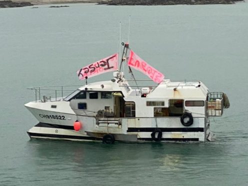 French fishing vessels stage a protest outside the harbour at St Helier, Jersey (Josh Dearing/PA)