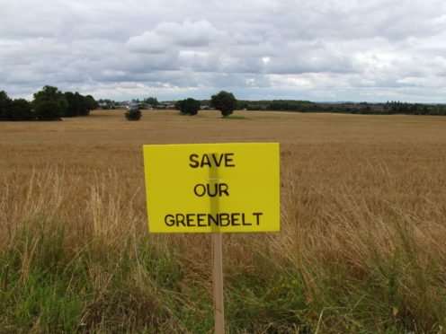 Poster at Florida Farm, Haydock, Merseyside, where green belt land was built over (Pat Hurst/PA)