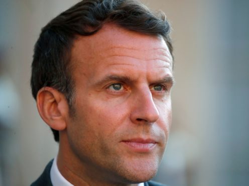 Emmanuel Macron was slapped in the face (Francois Mori/AP)