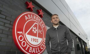 Aberdeen midfielder Dylan McGeouch puts thoughts about his Pittodrie future on the back burner