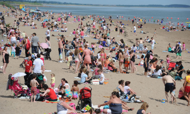 Sun seekers enjoy a balmy day in Broughty Ferry beach